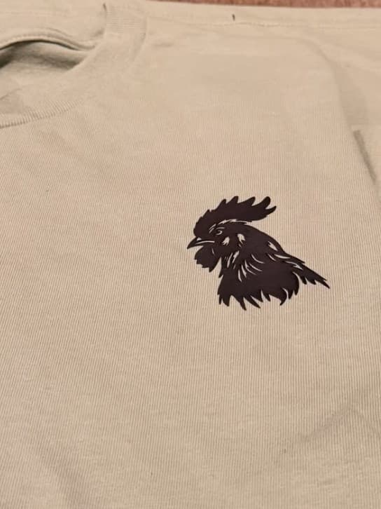 Gabbie's finished tan shirt with a small rooster, front